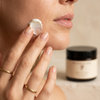 Woman applying cold-pressed natural face cream Victor and Jane skincare ritual